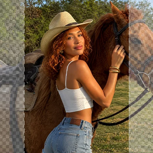 Woman with curly red hair in a cowboy hat petting a horse